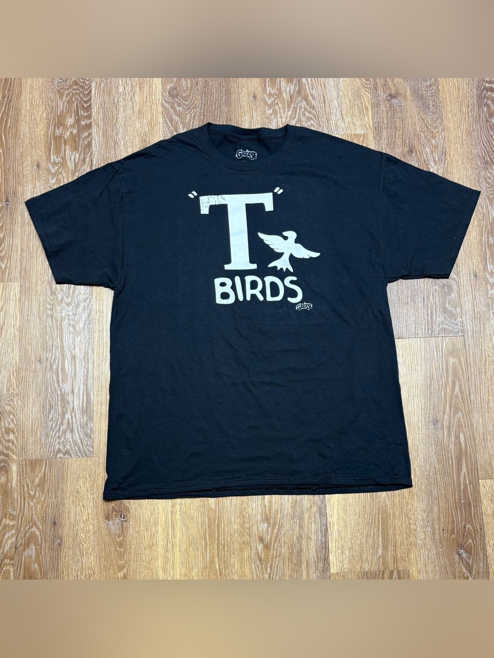Greats Black T-Shirt with White "T" and Bird Graphic
